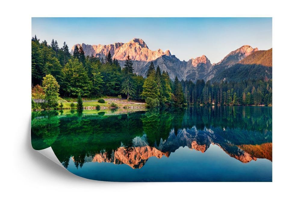 Fototapet - Calm morning view of fusine lake. colorful summer sunrise in julian alps with mangart peak on background pr