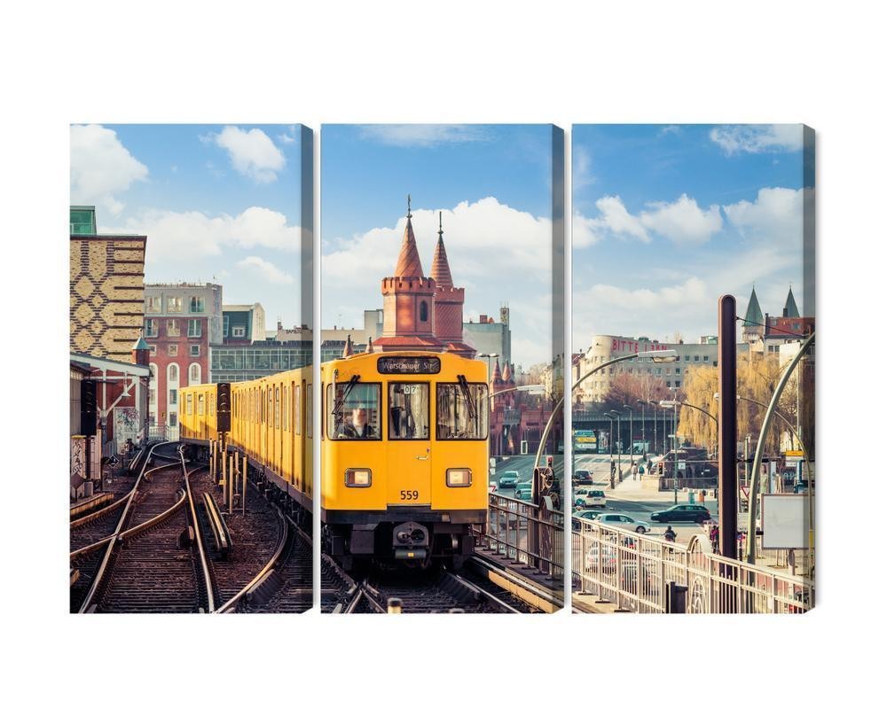 Flerdelt lærred gult tog i berlin på jernbaneskinnerne